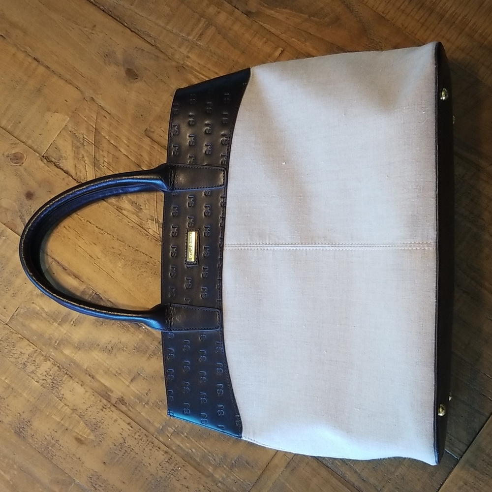 St. John tan linen tote bag with SJ embossed detailing across top.